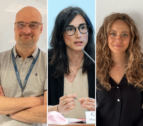 Expertos en oncología discutiendo tratamientos innovadores en conferencia