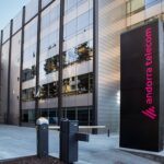 Edificio moderno de Andorra Telecom con logo visible en la entrada.